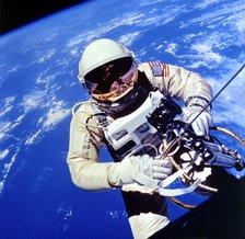 US Astronaut Edward H. White II carrying out external tasks. Artist: Unknown