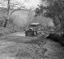 Singer Super Six driving through a ford at Croydon Hill, near Timberscombe, Somerset, 1930s Artist: Bill Brunell.