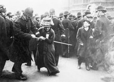 A suffragette struggling with a policeman on 'Black Friday', 18th November 1910. Artist: Unknown