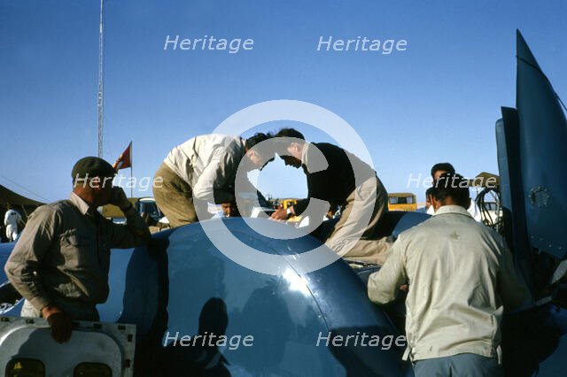 Mechanics working on Bluebird CN7 for World Land speed record attempt, Lake Eyre, 1964. Creator: Unknown.