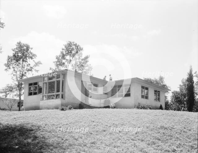 The model house nears completion, Hightstown, New Jersey, 1936. Creator: Dorothea Lange.