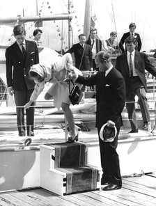 Prince Philip helps Princess Anne off Chay Blyth's boat, Hamble, Hampshire, c1960s. Creator: Unknown.