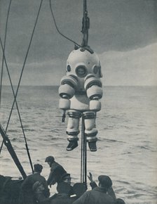 'The Eternal Fight Against the Sea: Armoured Casing for the Deep-Sea Diver', c1935. Artist: Pacific and Atlantic.