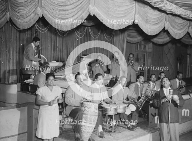 Portrait of Machito, Jose Mangual, Carlos Vidal(?), Mario Bouza...Glen Island Casino, N.Y., 1947. Creator: William Paul Gottlieb.
