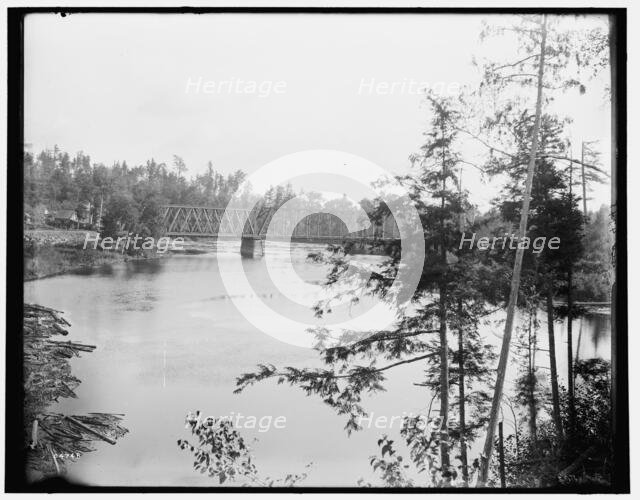 Quinnesee [sic] Falls, Mich., the river above the falls, between 1880 and 1899. Creator: Unknown.