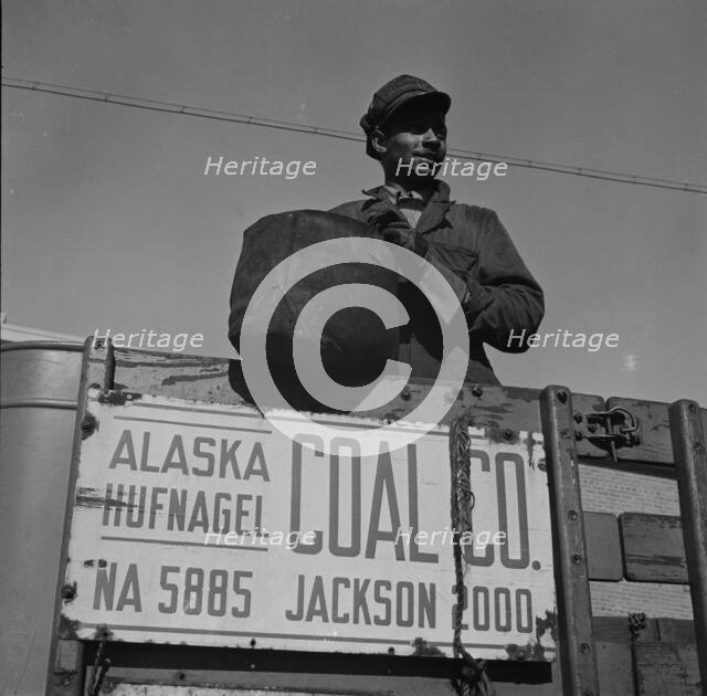 Negro coal hauler for the Alaska Hufnagel Coal Company, Washington, D.C., 1942. Creator: Gordon Parks.
