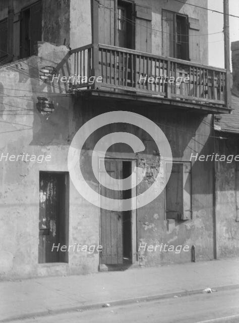 Facade of a multi-story house in the French Quarter, New Orleans, between 1920 and 1926. Creator: Arnold Genthe.