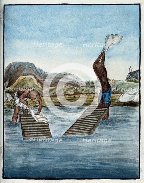 Two washer-men cleaning clothes by beating them against washing racks in a river. Creator: Unknown.