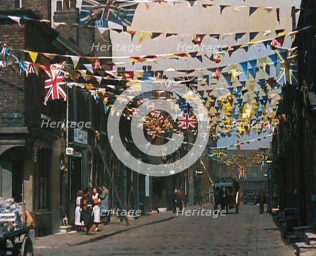 A Street is Decorated With Bunting For the Coronation of George VI, 1937. Creator: British Pathe Ltd.