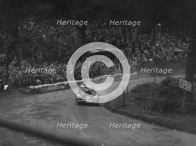Unidentified car with supercharger competing in the Shelsley Walsh Hillclimb, Worcestershire, 1935. Artist: Bill Brunell.