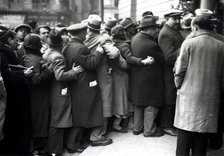 Group of people standing in line to visit the funeral chapel of Francesc Macia, president of the …