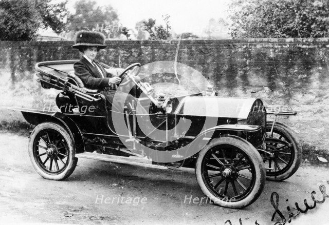 A woman at the wheel of an 8hp Humber, 1909. Artist: Unknown