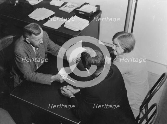 Night meeting in the FSA office, Visalia, Tulare County, California, 1938. Creator: Dorothea Lange.