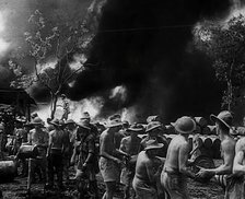 Commonwealth Troops Watching Flames and Smoke Emitting from a Supply Dump, 1941. Creator: British Pathe Ltd.