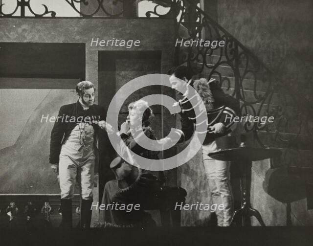 Woman sitting and two men standing, 1938. Creator: Unknown.