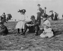 Parents and children seated on grass at state fair, St. Paul, Minnesota, 1900?. Creator: Unknown.