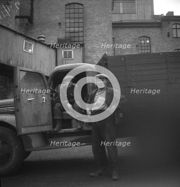 Lorry drivers at the sugar mill in Arlöv, Scania, Sweden, c1940s(?). Artist: Otto Ohm