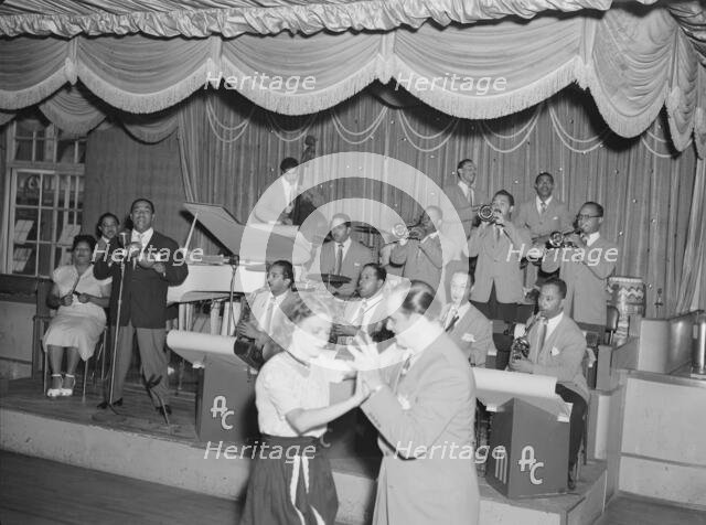 Portrait of Machito, Graciella Grillo, and Mario Bouza, Glen Island Casino, New York, 1947. Creator: William Paul Gottlieb.