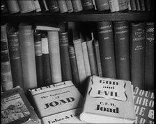 Books on a Bookshelf, 1930s. Creator: British Pathe Ltd.