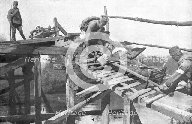 'La tragique retraite Serbe; Le transport des blesses sur la rive droite de la..., 1915 (1924). Creator: Vladimir Betzitch.