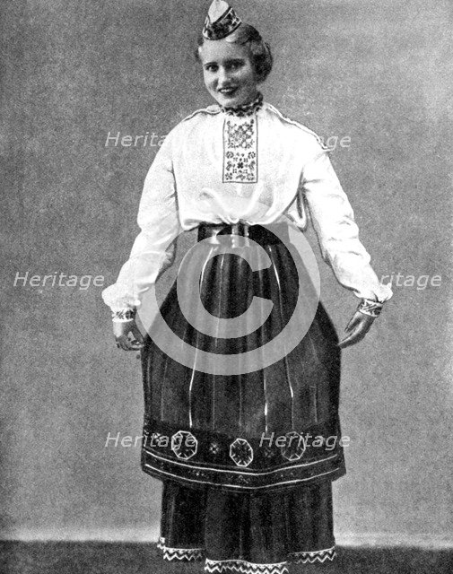 Estonian woman in traditional dress, 1936. Artist: Unknown