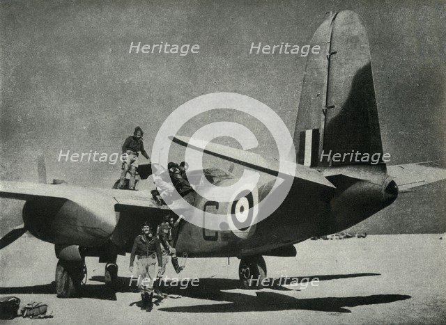 'The hot sun streams down on a desert landing ground', c1942-1943, (1945). Creator: Unknown.