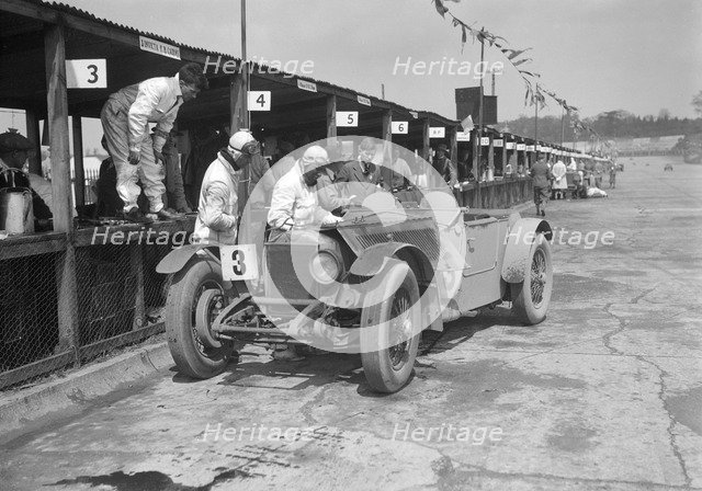Invicta of FH Cairnes and George Field in the pits at the JCC Double Twelve race, Brooklands, 1931. Artist: Bill Brunell.