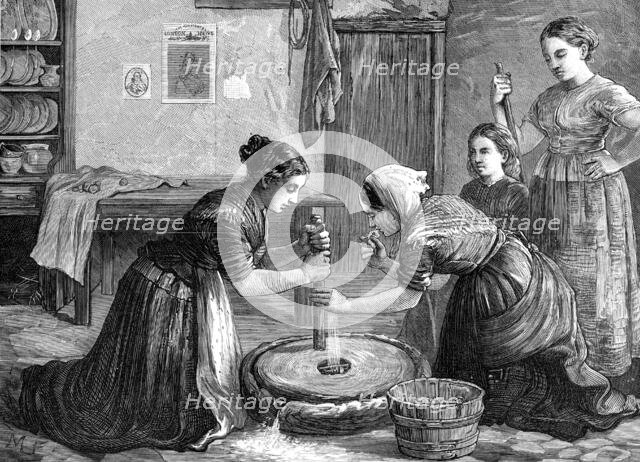 Women grinding corn in Ireland, 1874. Creator: Unknown.