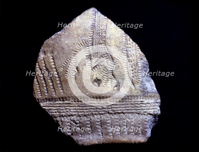 Cardium pottery fragment with anthropomorphic figures, they seem two persons with arms raised as …