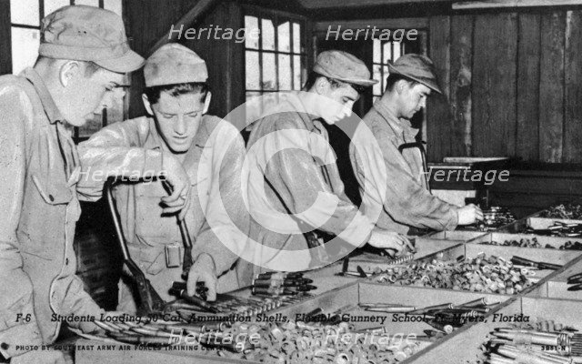 Students loading 50 cal ammunition shells, Flexible Gunnery School, Fort Myers, Florida, USA, 1943. Artist: Southeast Army Air Forces Training Center