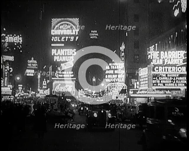 New York Times Square at Night Lit up By Lights, 1920s. Creator: British Pathe Ltd.