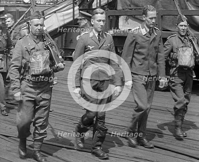 Two Captured German Pilots Being Escorted Away, 1940. Creator: British Pathe Ltd.