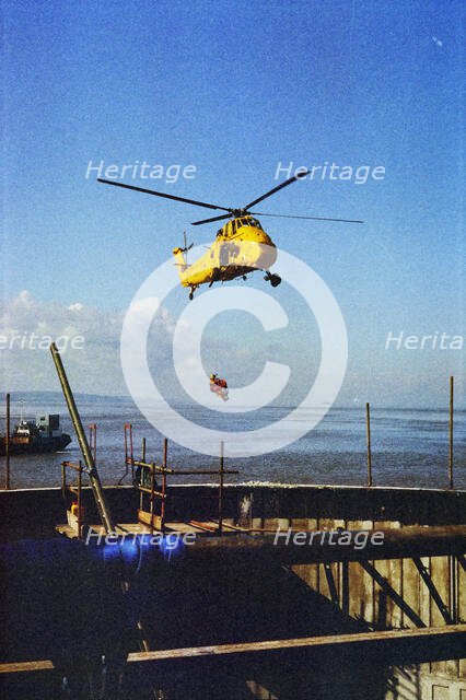 RAF Rescue helicopter hovering over the Second Severn Construction site..., Apr 1992 - 1995. Creator: John Laing plc.