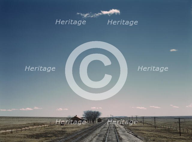 Passing a section house along the Atchison, Topeka, and Santa Fe railroad, New Mexico, 1943. Creator: Jack Delano.