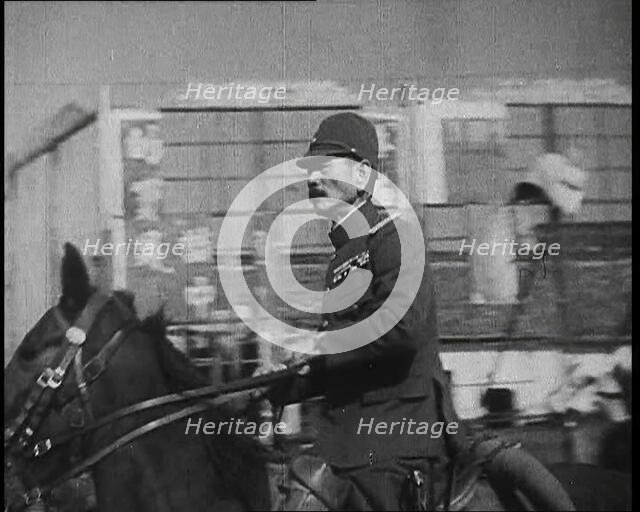 Close up of a Male Japanese Military Officer on Horseback Riding Along a Road During..., 1938. Creator: British Pathe Ltd.