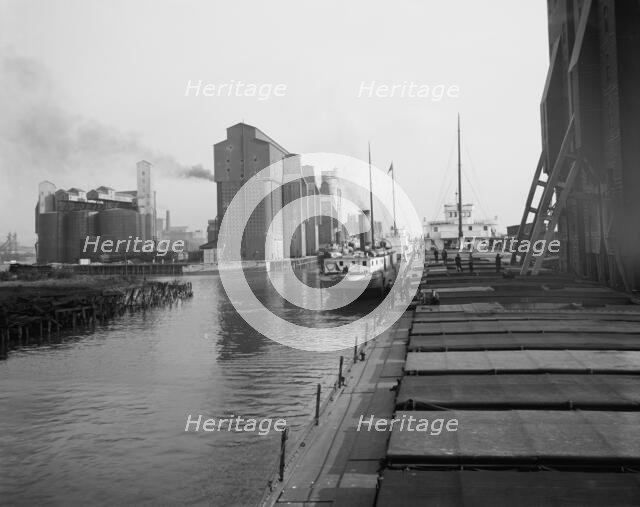 Unloading wheat, Buffalo, N.Y., c.between 1910 and 1920. Creator: Unknown.