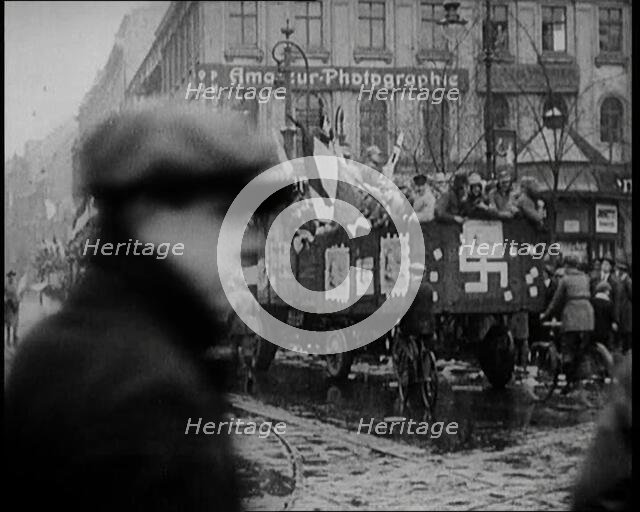 National Socialist (Nazi) Party Campaigning in Germany Scattering Pamphlets from  Trucks..., 1926. Creator: British Pathe Ltd.