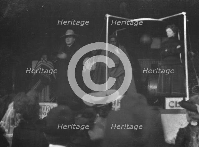 Sidewalk performance or carnival performance, Cliff Dwellers, between 1896 and 1911. Creator: Arnold Genthe.