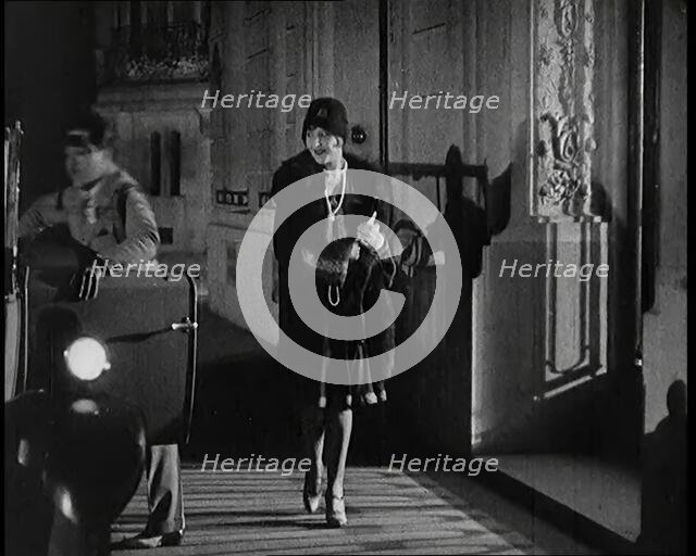 Scene from the Film 'The Compulsory Husband':  The Actor Monty Banks Opening the Car..., 1920s. Creator: British Pathe Ltd.