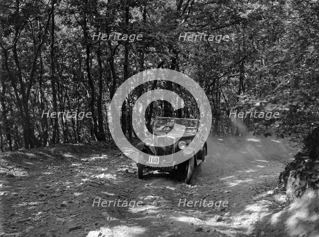 Morris Minor competing in the B&HMC Brighton-Beer Trial, Fingle Bridge Hill, Devon, 1934. Artist: Bill Brunell.