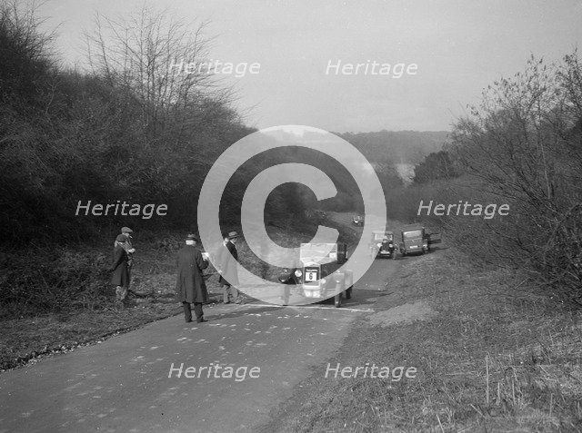 Bayliss-Thomas of WJ Hayward, winner of the JCC Half-Day Trial, Ranmore Common, Surrey, 1930. Artist: Bill Brunell.