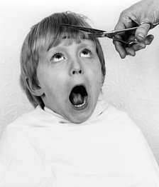 Boy having a haircut, 1988.