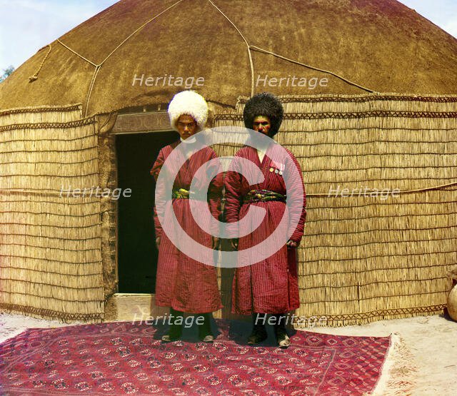 Two men standing on a rug, in front of yurt, between 1905 and 1915. Creator: Sergey Mikhaylovich Prokudin-Gorsky.