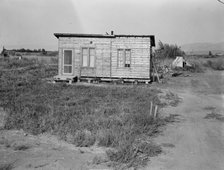 Homes are built bit by bit with whatever materials are available, Yakima,Washington, 1939. Creator: Dorothea Lange.