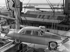 1962 Jaguar MkX being loaded on to Saxonia ship at Southampton docks for export. Creator: Unknown.