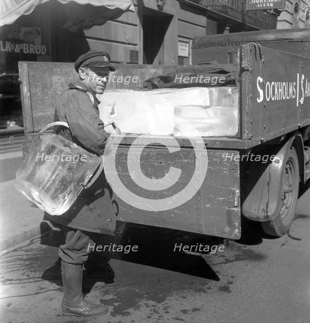 Iceman busy during the heatwave in Stockholm, Sweden, 24th July 1943. Artist: Karl Sandels