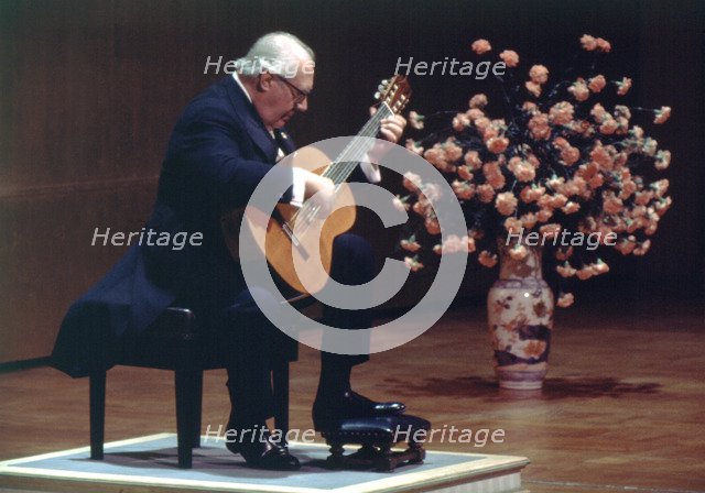 Andrés Segovia (1894-1987), Spanish concert guitar during a performance in Madrid.