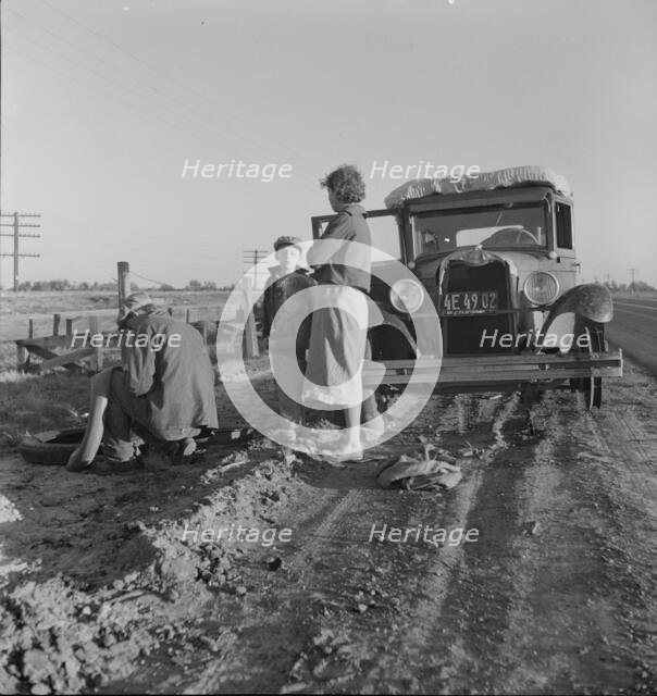 Migratory agricultrual worker family along California highway, U.S. 99, 1937. Creator: Dorothea Lange.