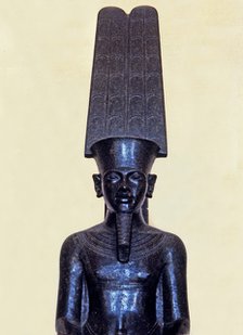 Statue of the god Amon protecting Tutankhamen, made in black granite, 1350 b.C, detail of the top…