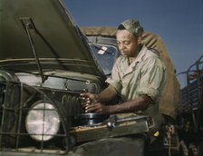 Colored mechanic, motor maintenance section, Ft. Knox, Ky., 1942. Creator: Alfred T Palmer.